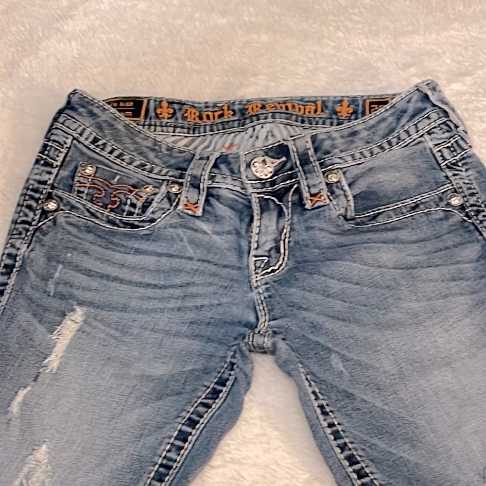 Rock Revival Alleen Skinny Jeans. Pink stitching. Made to look worn.